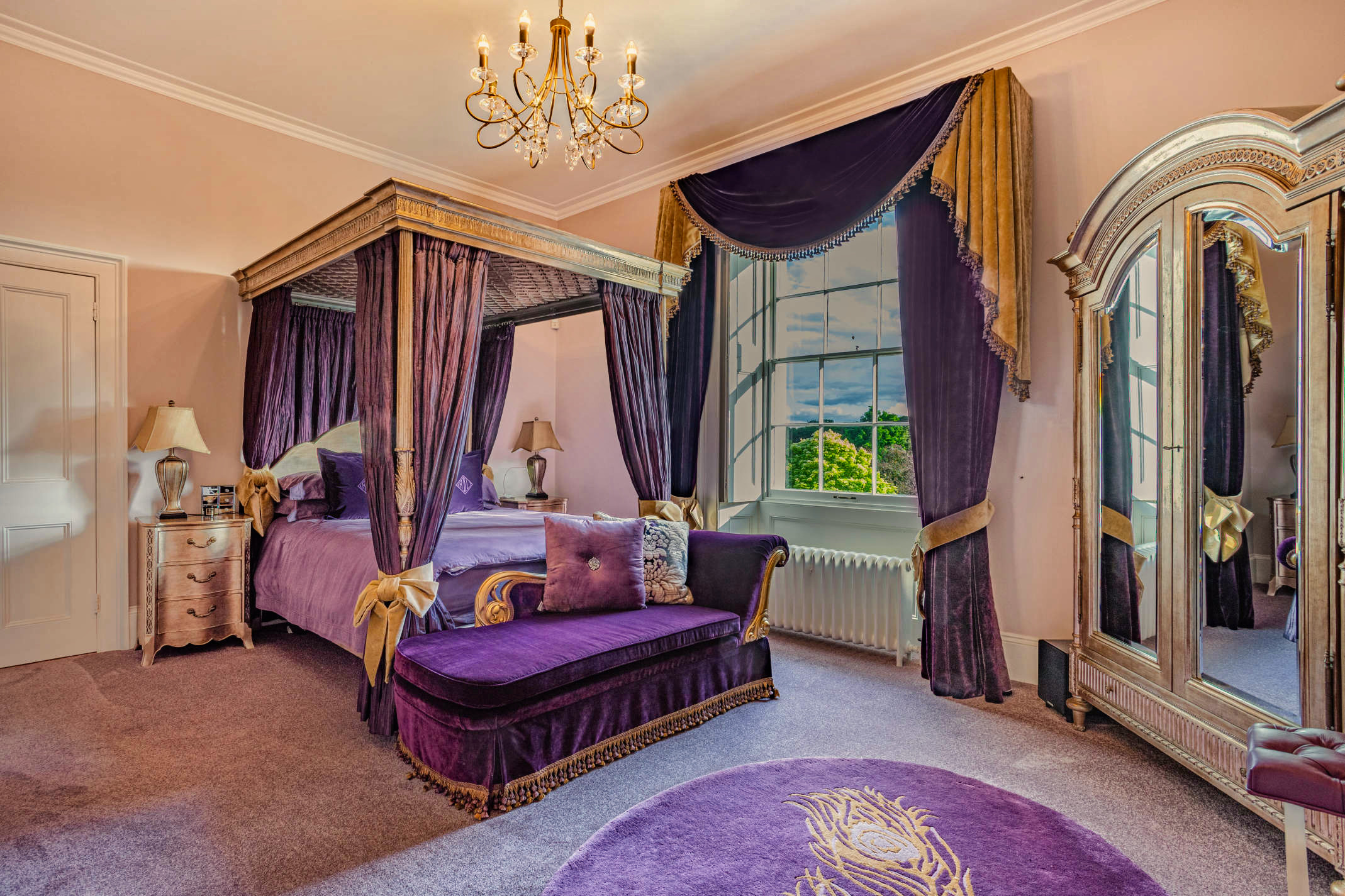 A four poster bed in one of the bedrooms at Hemingford Park